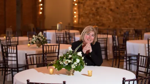 Lisa Ditchkoff sitting at a table smiling